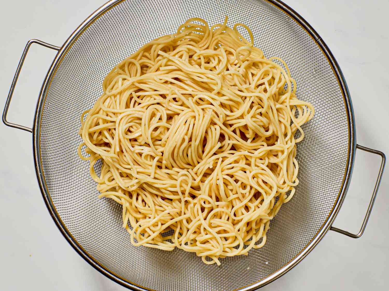 Noodles in a colander.