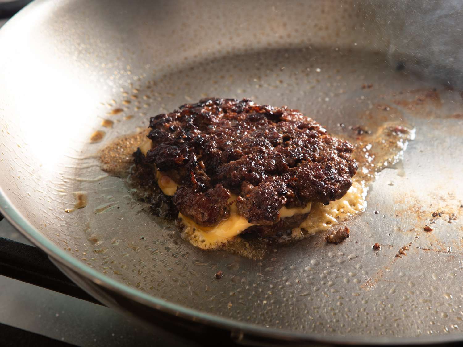 Adding cheese to burgers