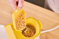 Popcorn kernels are added to the Presto Poplite Hot Air Popper
