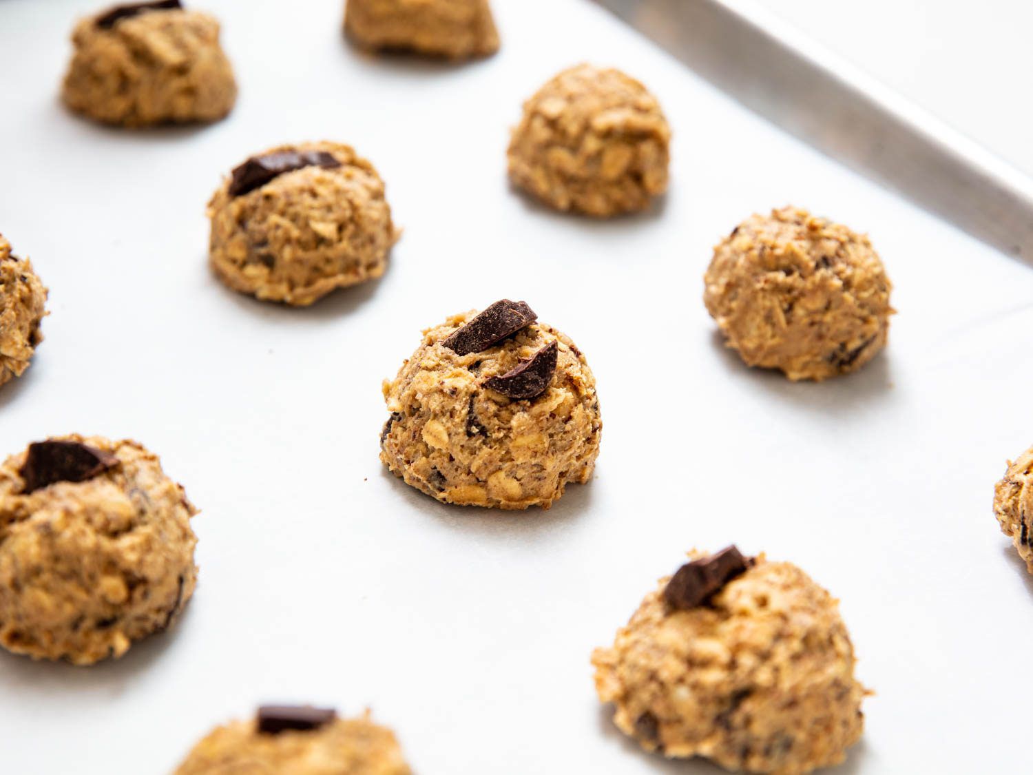 Cookie dough pieces garnished with extra chocolate chips on top.