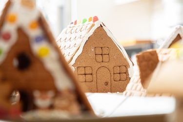 Decorative gingerbread houses arranged on a table