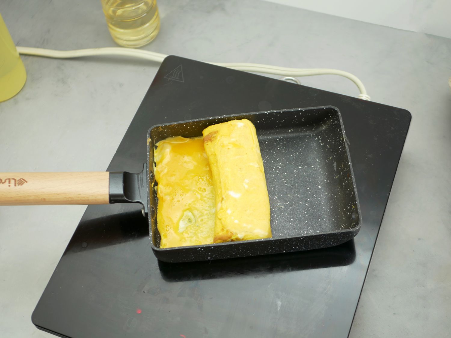 a tamagoyaki roll in the pan
