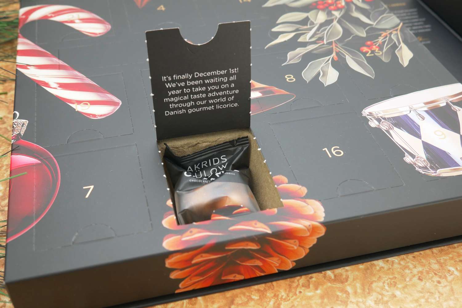 A door to the Lakrids by Bülow Holiday Advent Calendar opened to reveal a bag of licorice