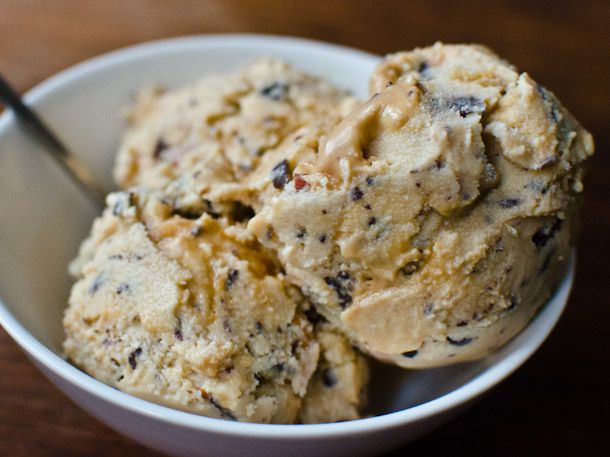 Closeup of a triple scoop of better than Snickers ice cream, served in a white bowl.