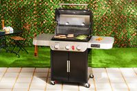 Weber Genesis EX-325S Propane Gas Smart Grill displayed on a patio