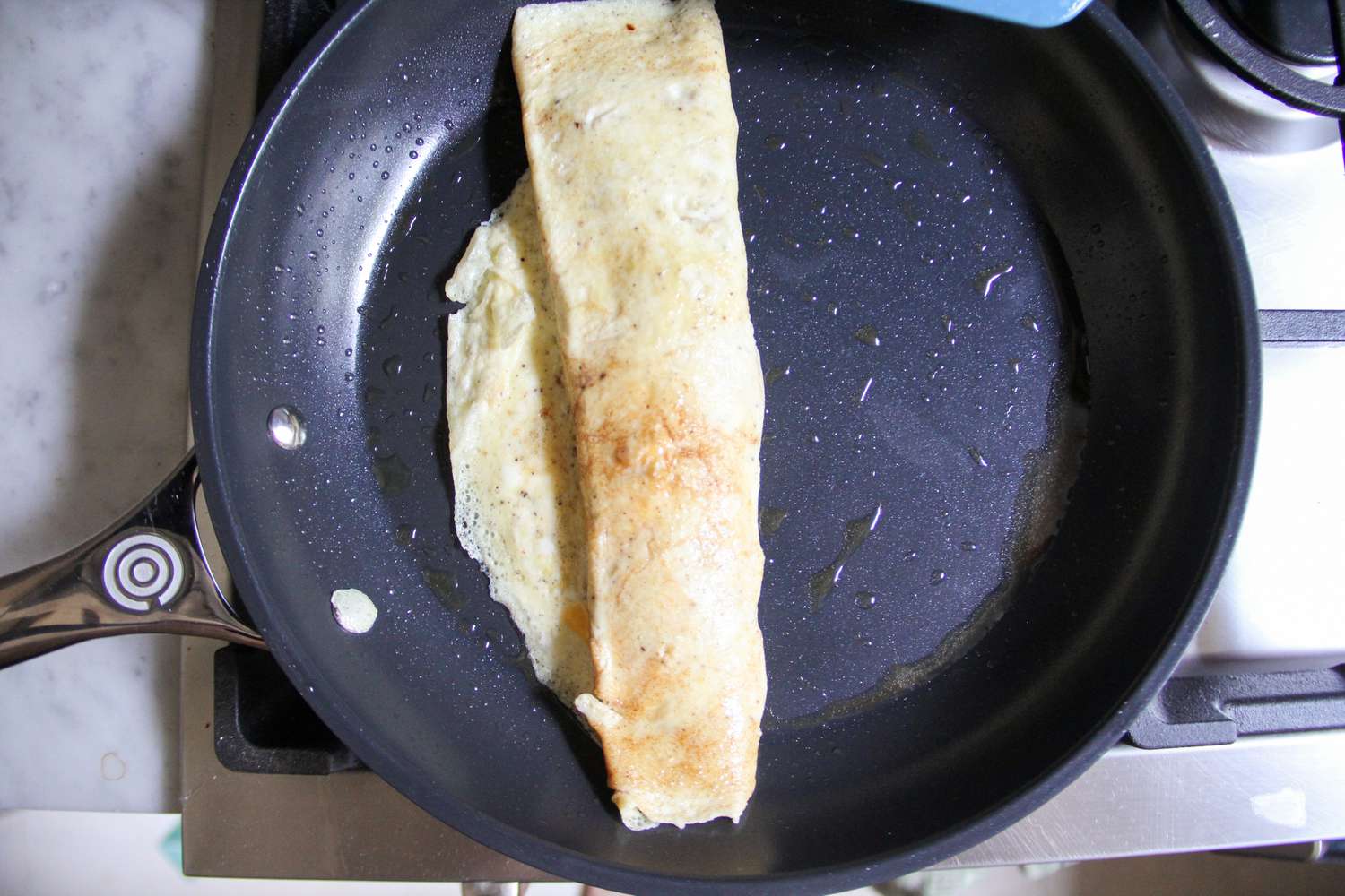 Food cooking in the Le Creuset Ceramic Nonstick Frying Pan