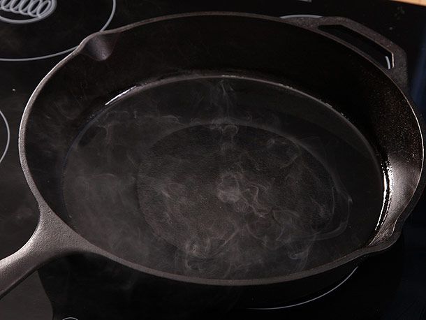 heating cast iron skillet on stovetop