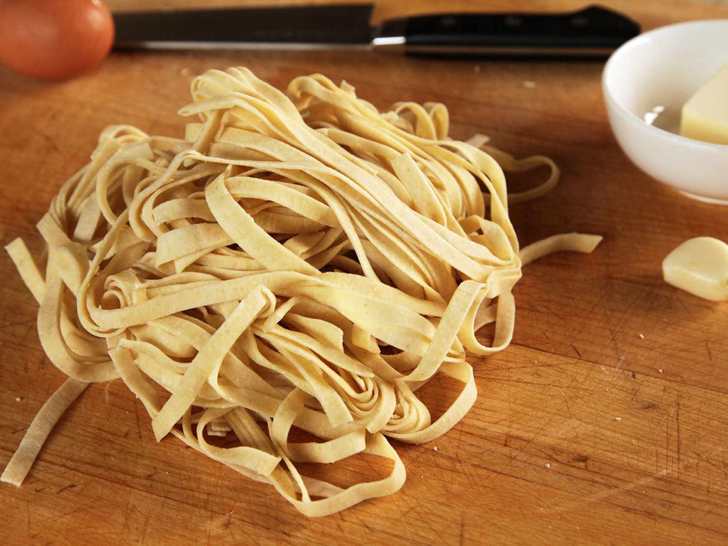 A tangle of uncooked fresh fettucine.