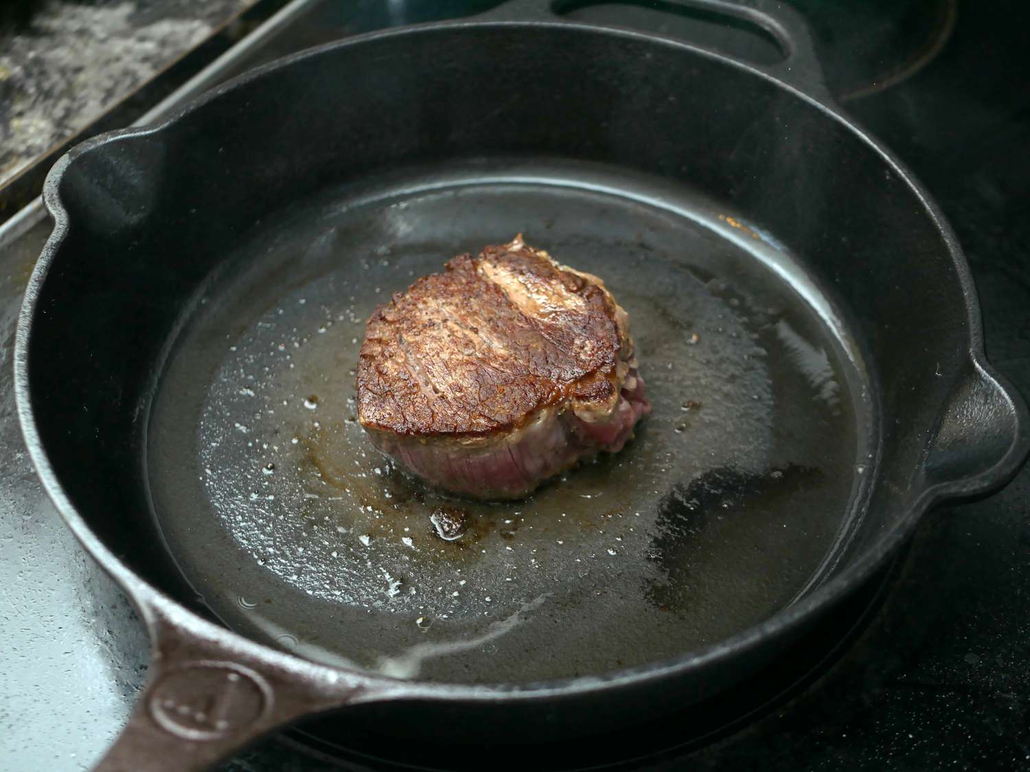 victoria skillet with a steak in it
