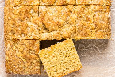 A closeup of a sliced snack cake with one piece slightly removed and placed at an angle
