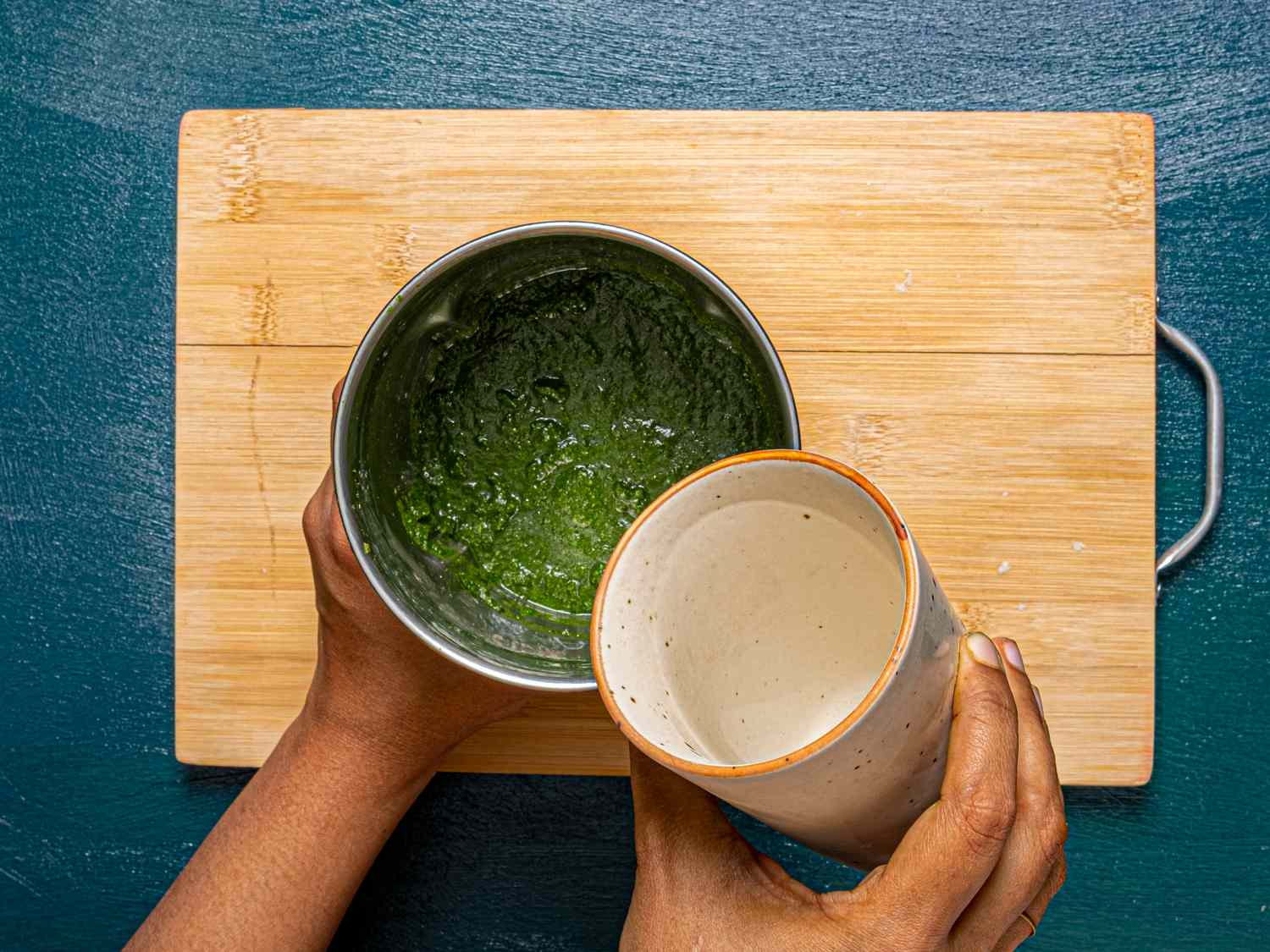 Adding a cup of water to mixture