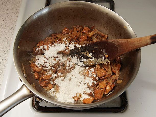 Flour is added to the chanterelle-shallot-garlic mixture.