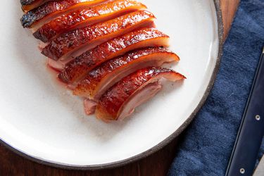 Crispy golden roasted duck crown sliced