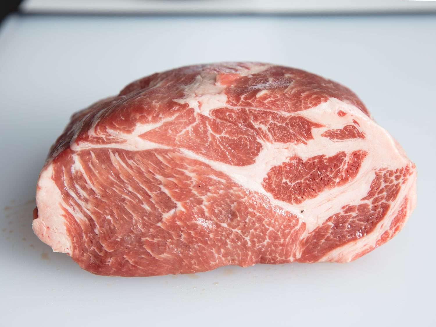 Side view of muscle groups in kurobuta pork shoulder roast