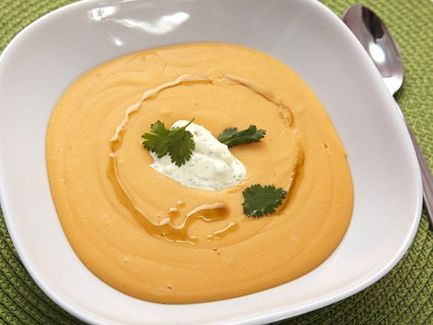 The finished soup, garnished with the seasoned yogurt, a few cilantro leaves, and a drizzle of olive oil.