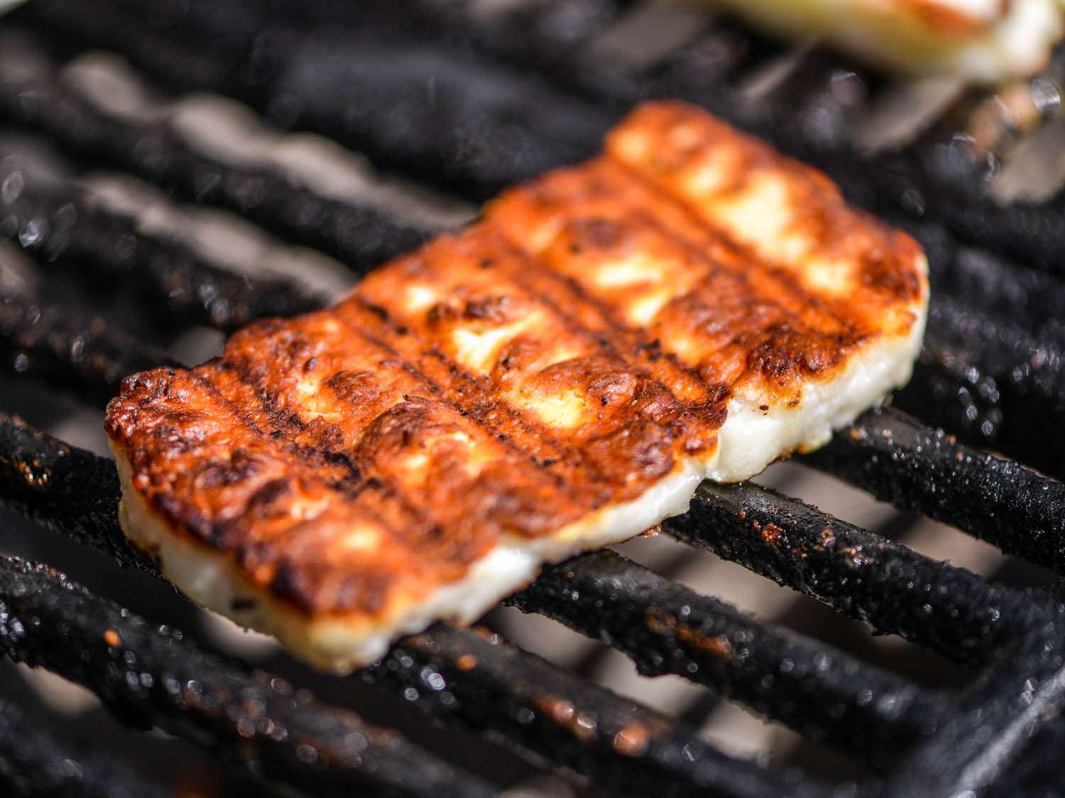 crisp golden slab of halloumi cheese on the grill