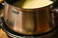 closeup of the dash fondue pot with cheese
