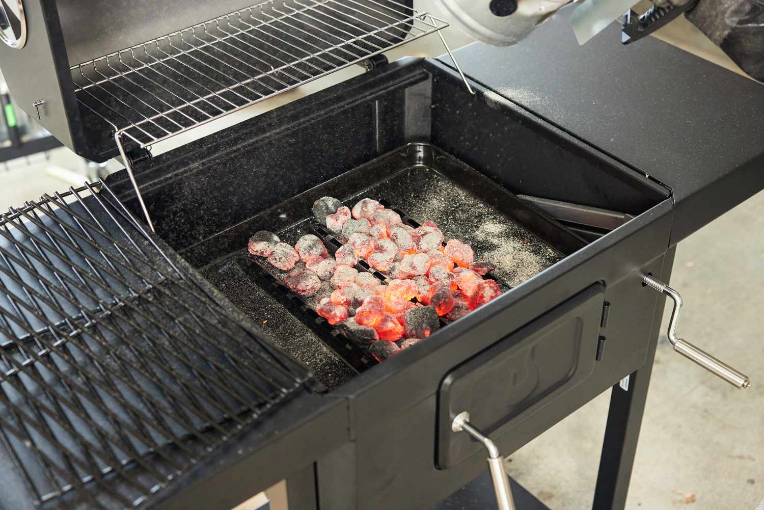 A close-up on a grill with adjustable dampers