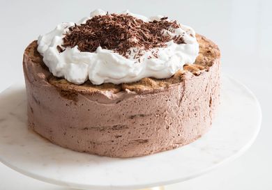 Mocha Icebox Cake topped with whipped cream and chocolate shavings