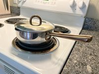 The Great Jones Little Saucy saucier on a white stovetop