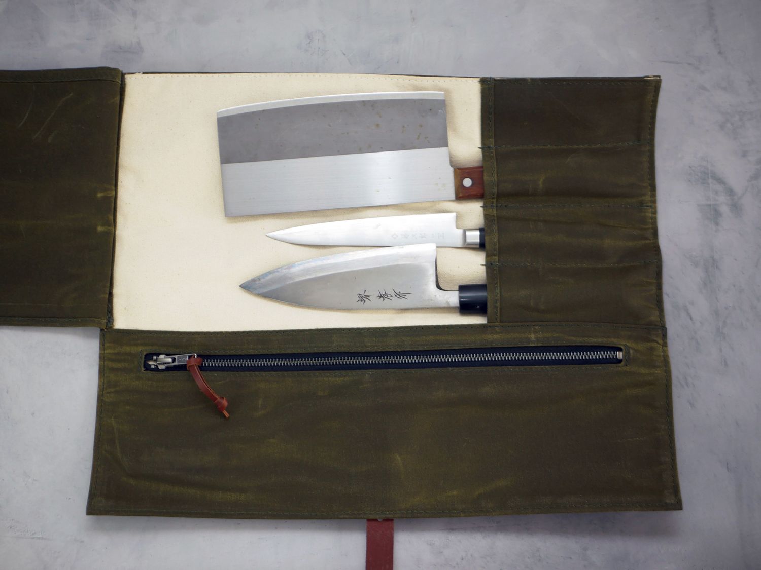 The hardmill knife roll opened to show three knives inside