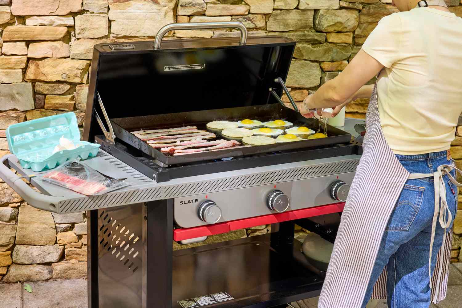 Food is cooked on the Weber Slate 28 inch Rust-Resistant 3 Burner Outdoor Griddle