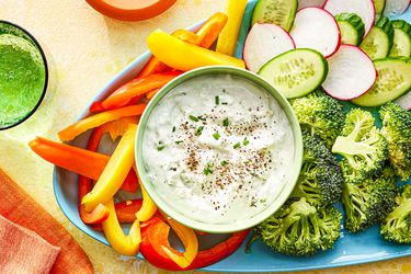 Overhead view of blue cheese dip on a veggie platter