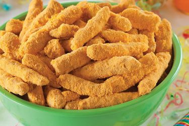 A green bowl filled with homemade cheetos.