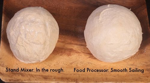 Two batches of New York style-pizza dough in balls: one barely kneaded in stand mixer, which tears (left), and one kneaded in food processor, which forms smooth ball (right).