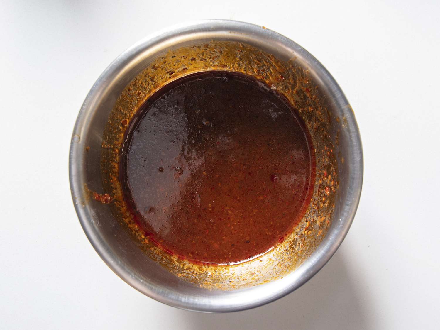Stir-fry sauce in a small metal bowl