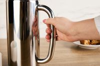 Person holding handle of Espro P7 French Press