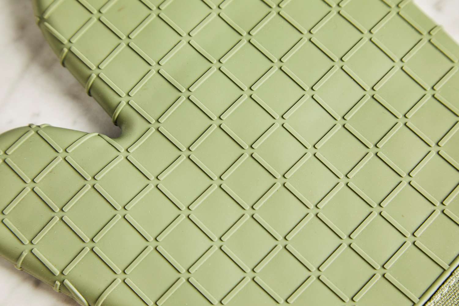 a closeup of silicone coating on an oven mitt