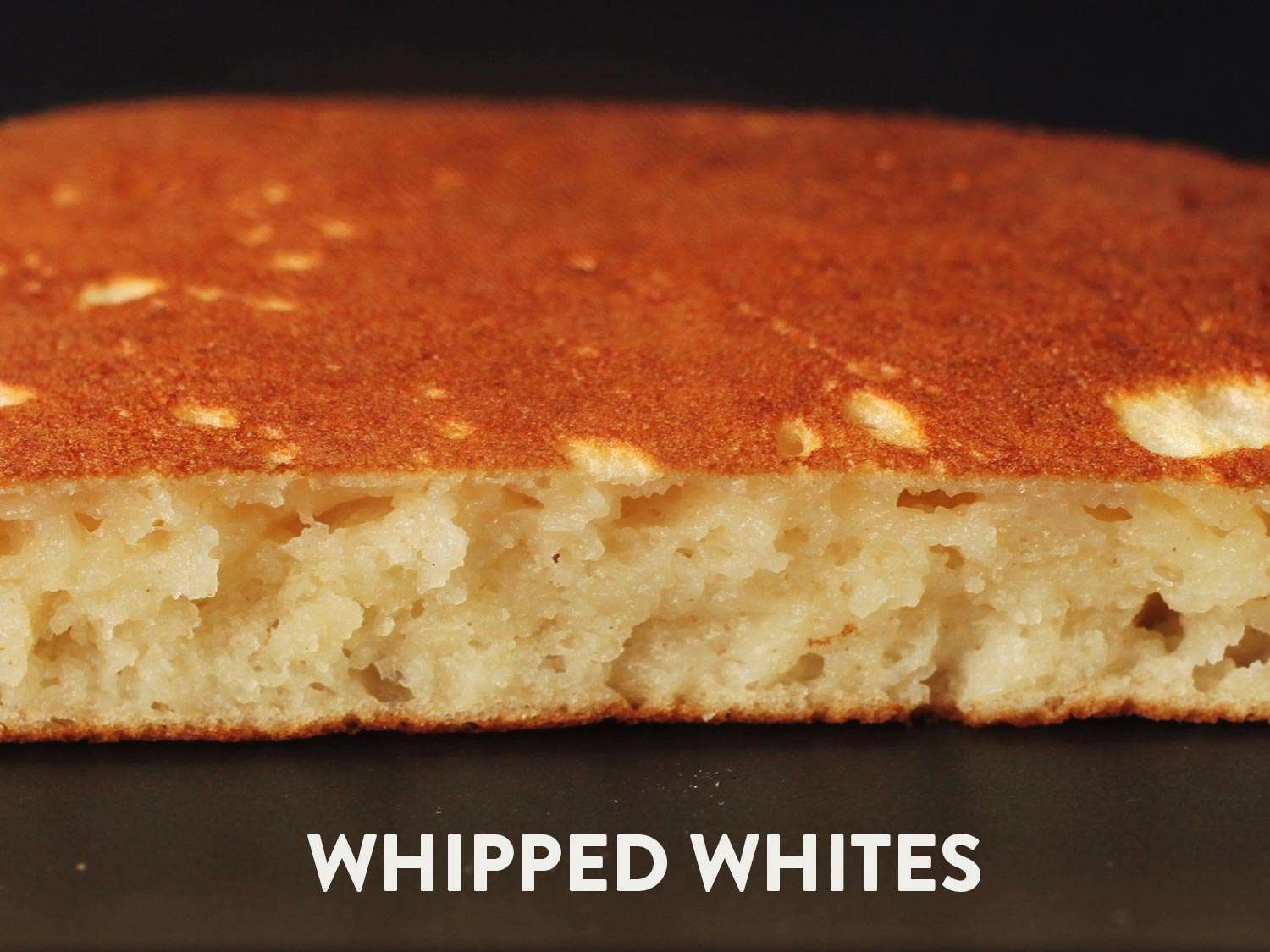 Closeup cross-section of fluffy pancake with a golden brown top