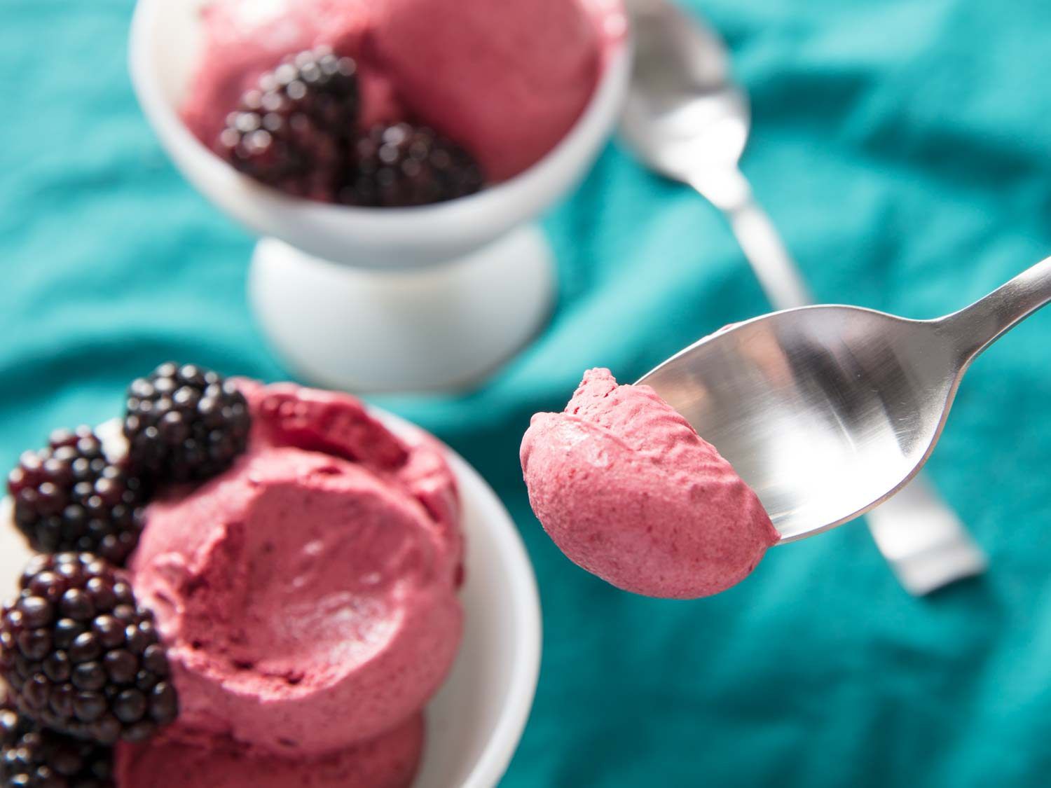 Close-up of a spoonful of blackberry ice cream.