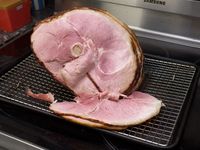 ham sliced on a baking sheet