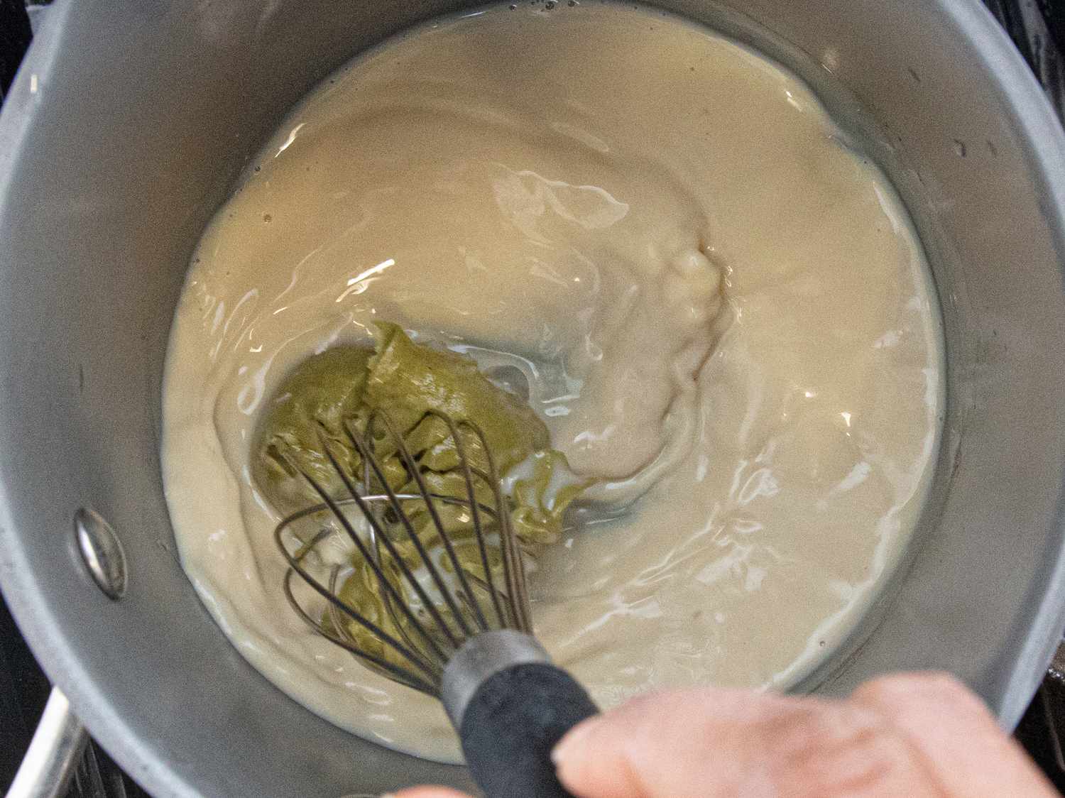 Whisking pistachio cream. 