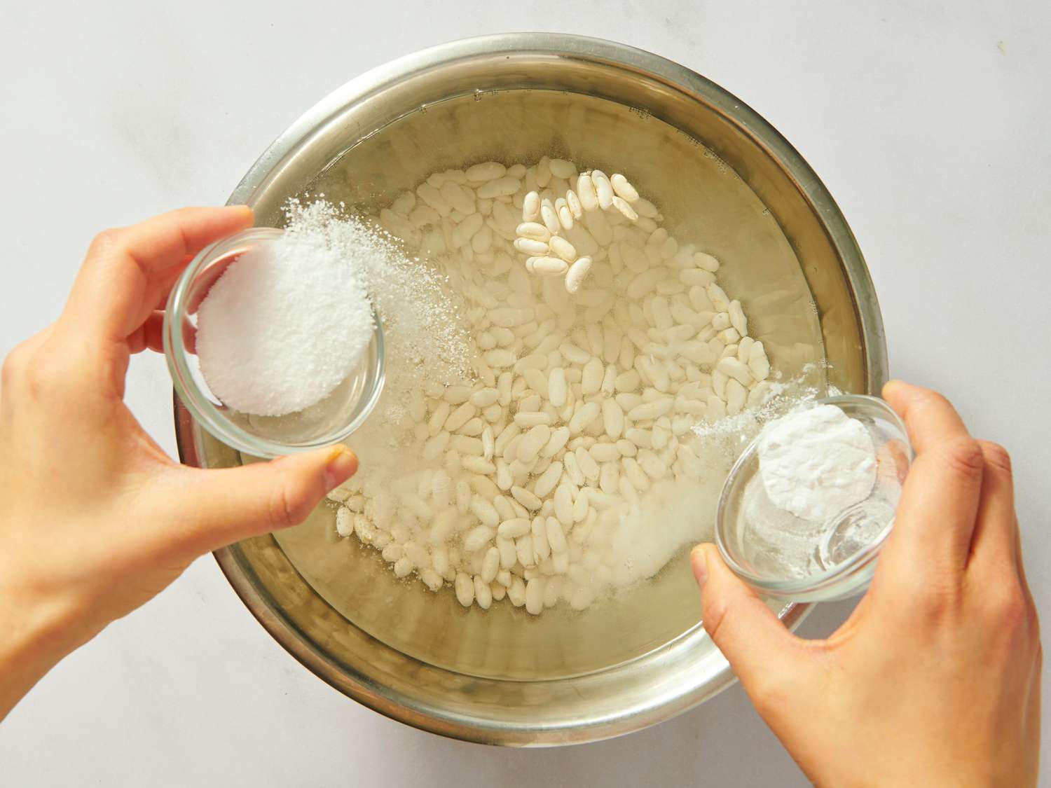 seasoning beans while they soak in water 