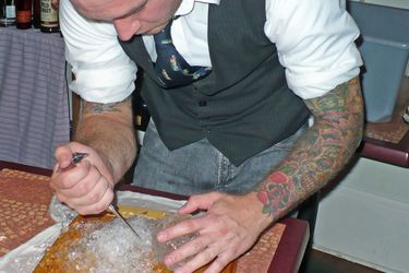 bartender using ice pick