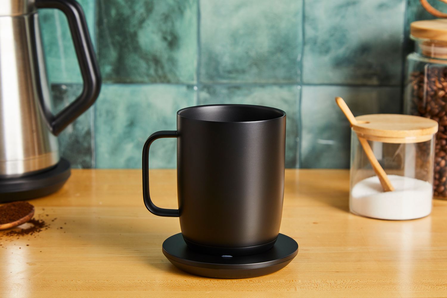 The Ember smart mug on its charging platform.