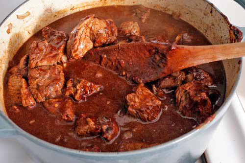 A dutch oven holding chili.