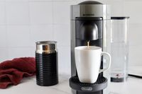 The Nespresso VertuoPlus Coffee and Espresso Machine by De'Longhi dispensing coffee into a mug