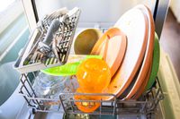 The Comfee countertop dishwasher filled with dirty dishes.