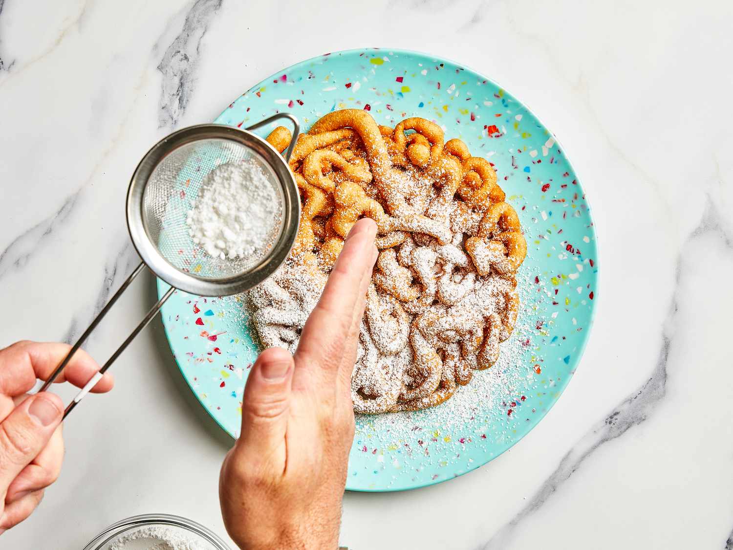 Overhead view of dusting with sugar