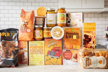 An assortment of pumpkinflavored products from Trader Joes arranged on a countertop