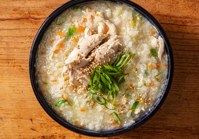 Overhead view of homemade dak juk, a comforting Korean rice porridge.