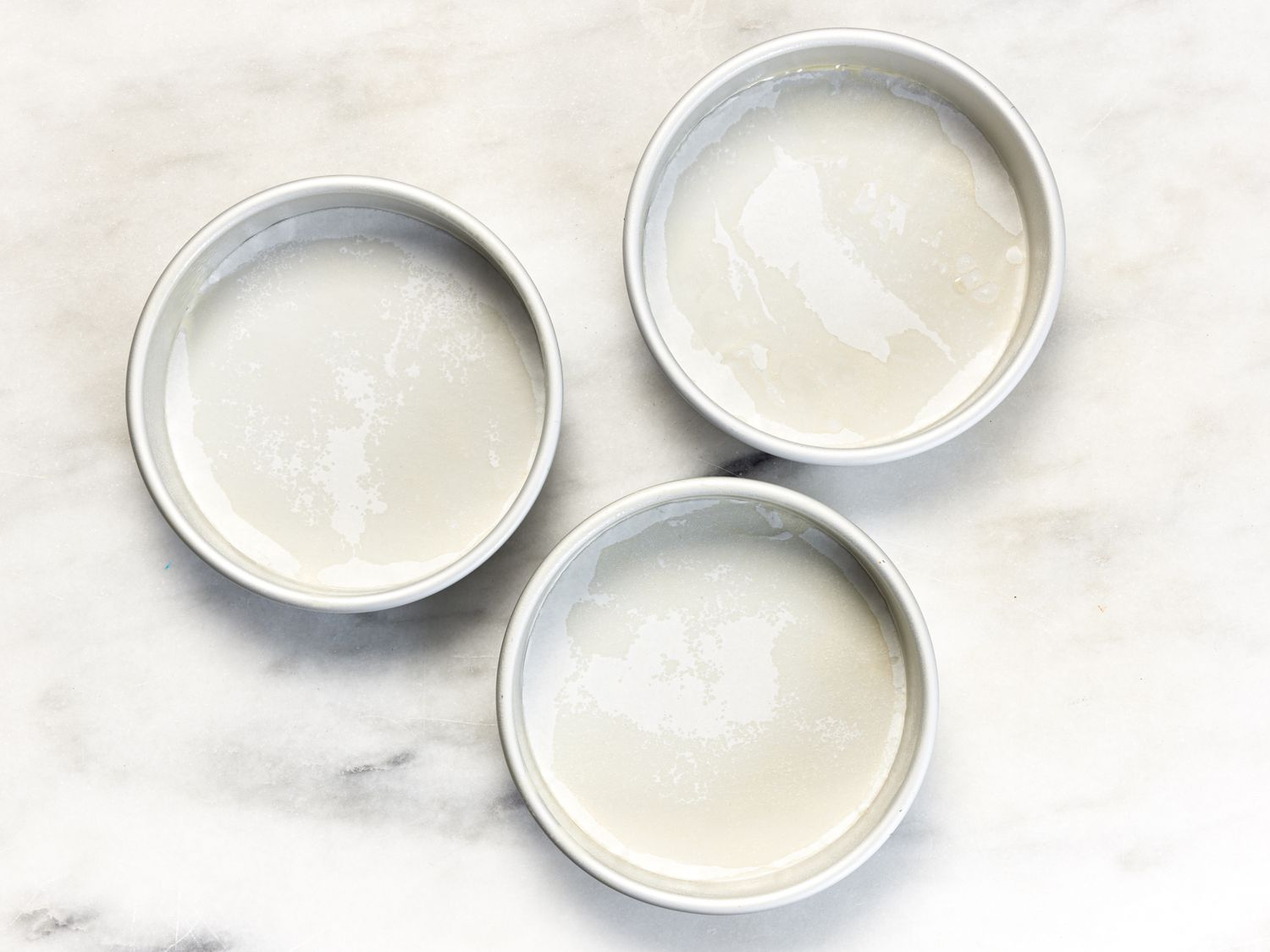 Overhead view of three cake pans