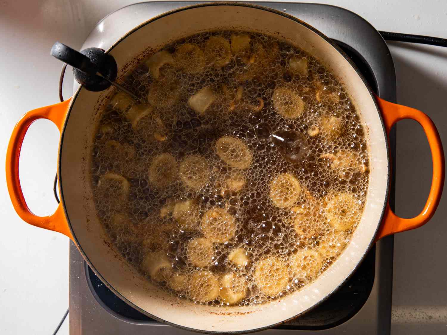 Frying squid in a Dutch oven.