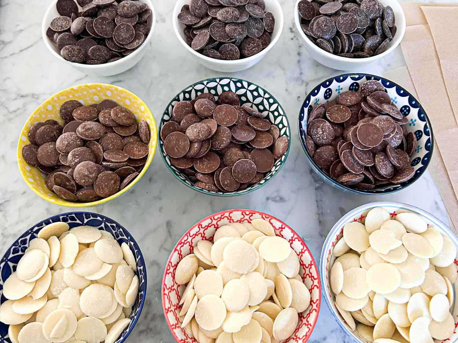 Bowl arrangement of chocolate wafers in various types and colors on a table