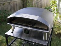 ooni koda 2 max on a table outside