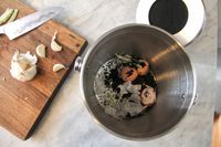 Epica countertop compost bin with food inside